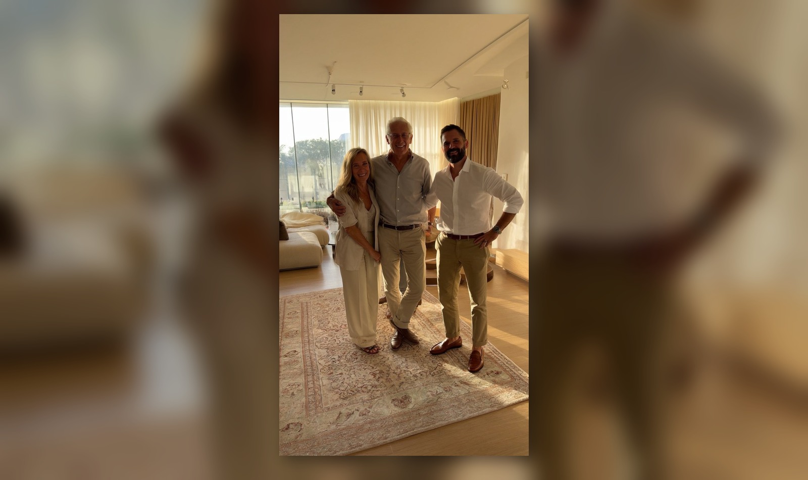 Clients in a warm living space with a rug